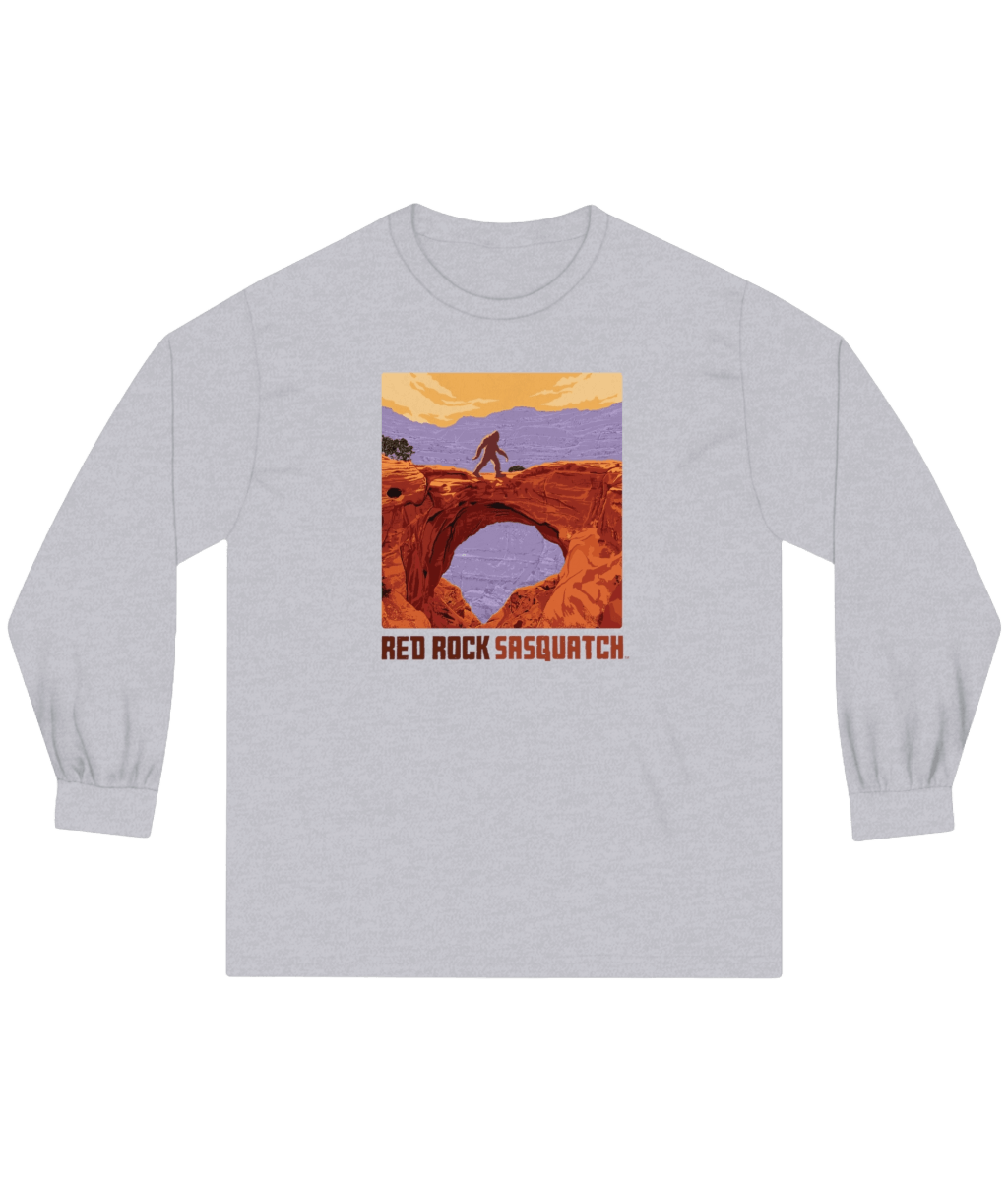 Athletic Heather Capitol Reef Long-Sleeve Tee. Features a Sasquatch figure on a natural bridge in Capitol Reef National Park.