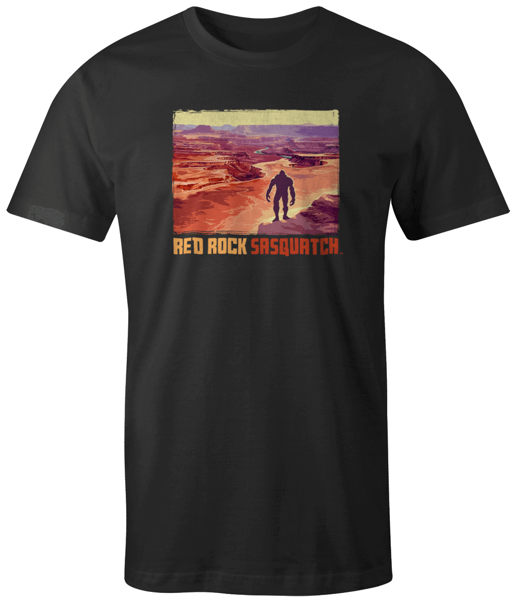Black short-sleeve t-shirt featuring a Sasquatch overlooking the vast canyons of Canyonlands National Park.