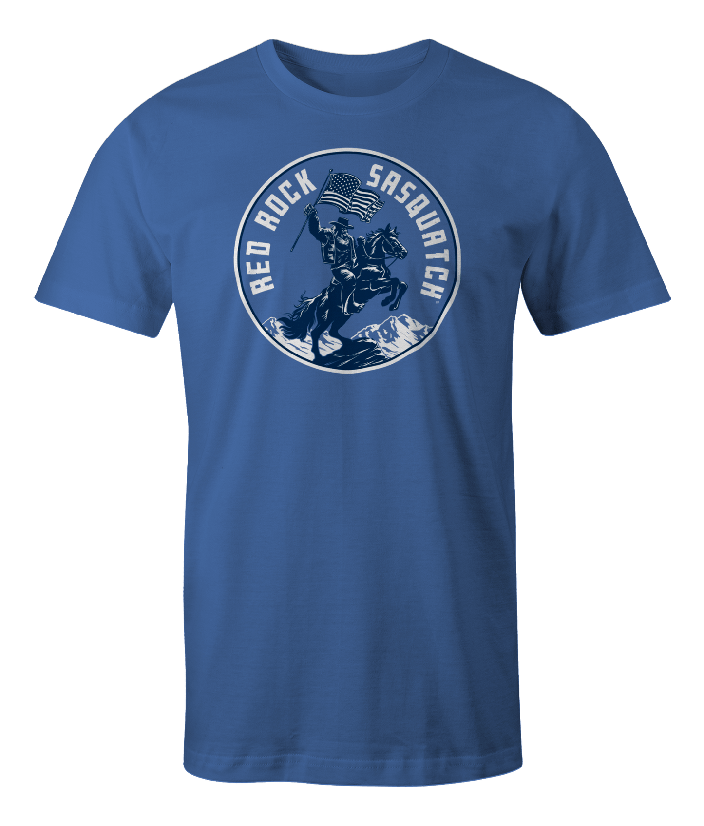 Mystic Blue Squatchrider t-shirt with white text. Features Sasquatch riding a horse and waving an American flag. A bold and patriotic design.