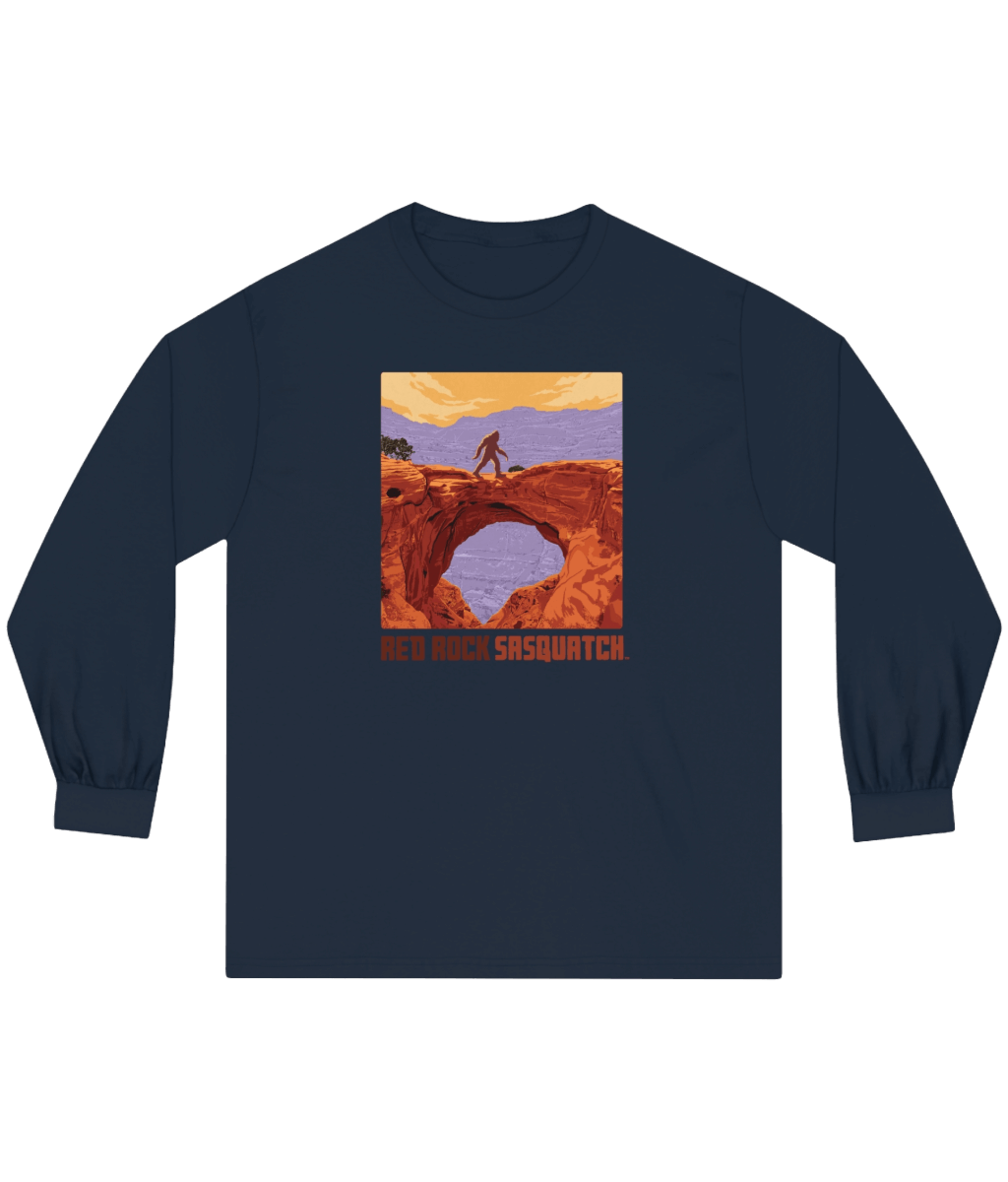Navy Capitol Reef Long-Sleeve Tee. Depicts a Sasquatch silhouette overlooking a canyon arch in Capitol Reef National Park.