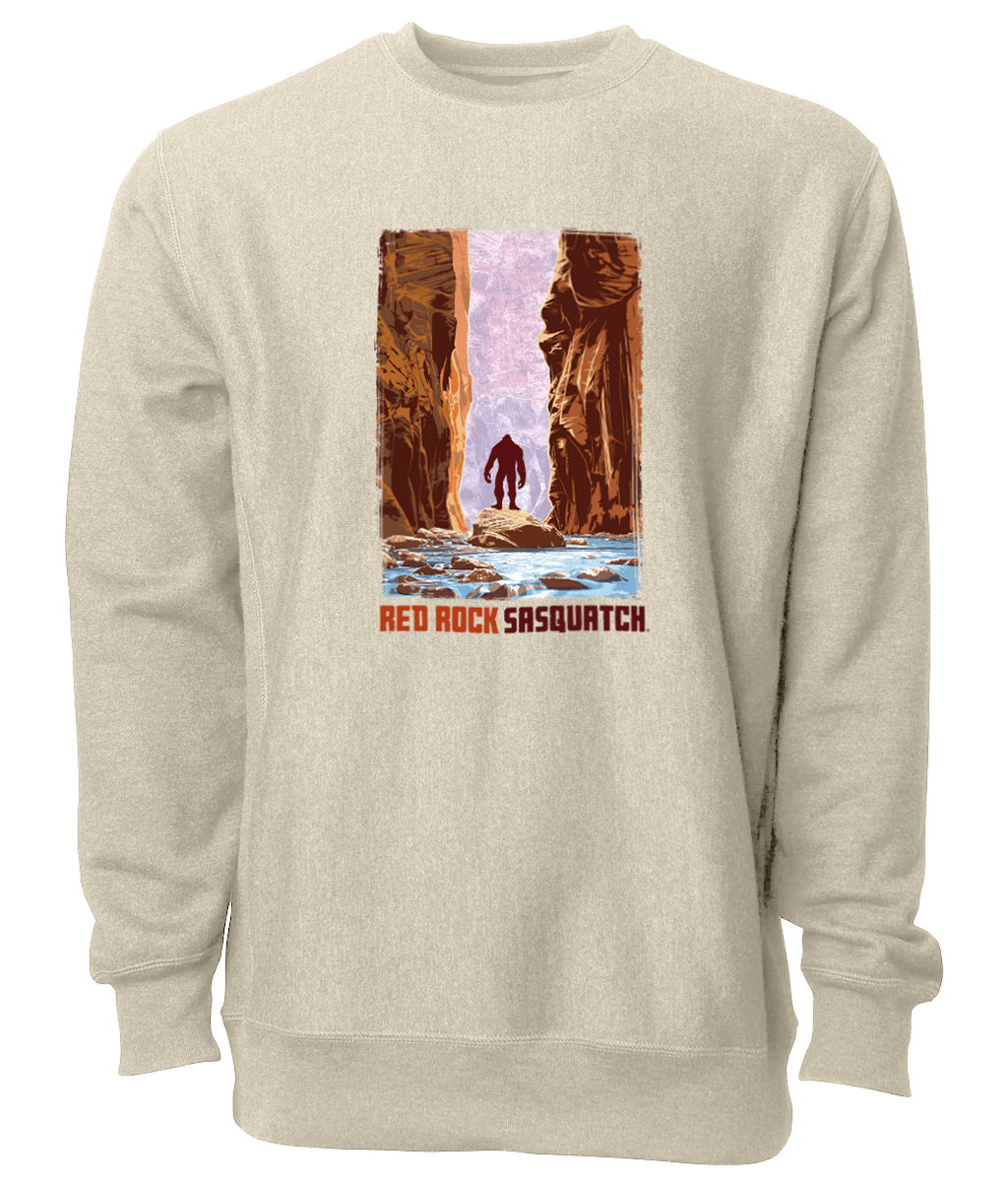 This Oatmeal Heather-colored crewneck sweatshirt showcases a Sasquatch wading through The Narrows in Zion National Park. Ideal for outdoor adventures and casual wear.