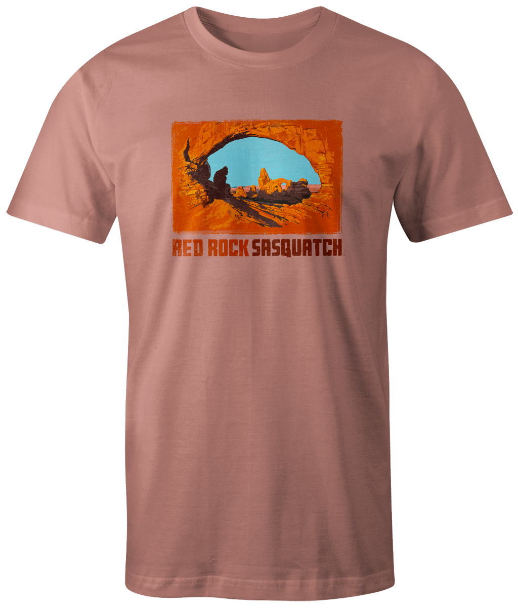 Terracotta short-sleeve t-shirt featuring a Sasquatch design at the famous Delicate Arch.