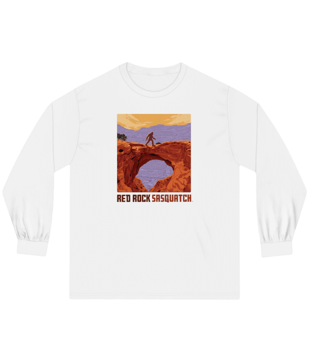 White Capitol Reef Long-Sleeve Tee. Displays a Sasquatch design at a scenic overlook in Capitol Reef.