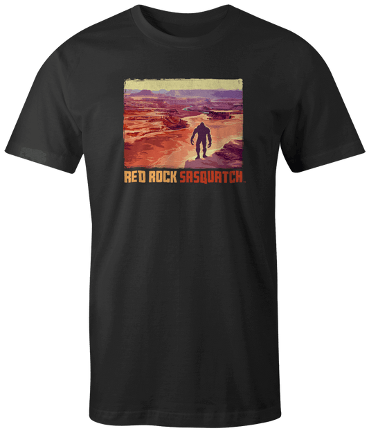 Black short-sleeve t-shirt featuring a Sasquatch overlooking the vast canyons of Canyonlands National Park.