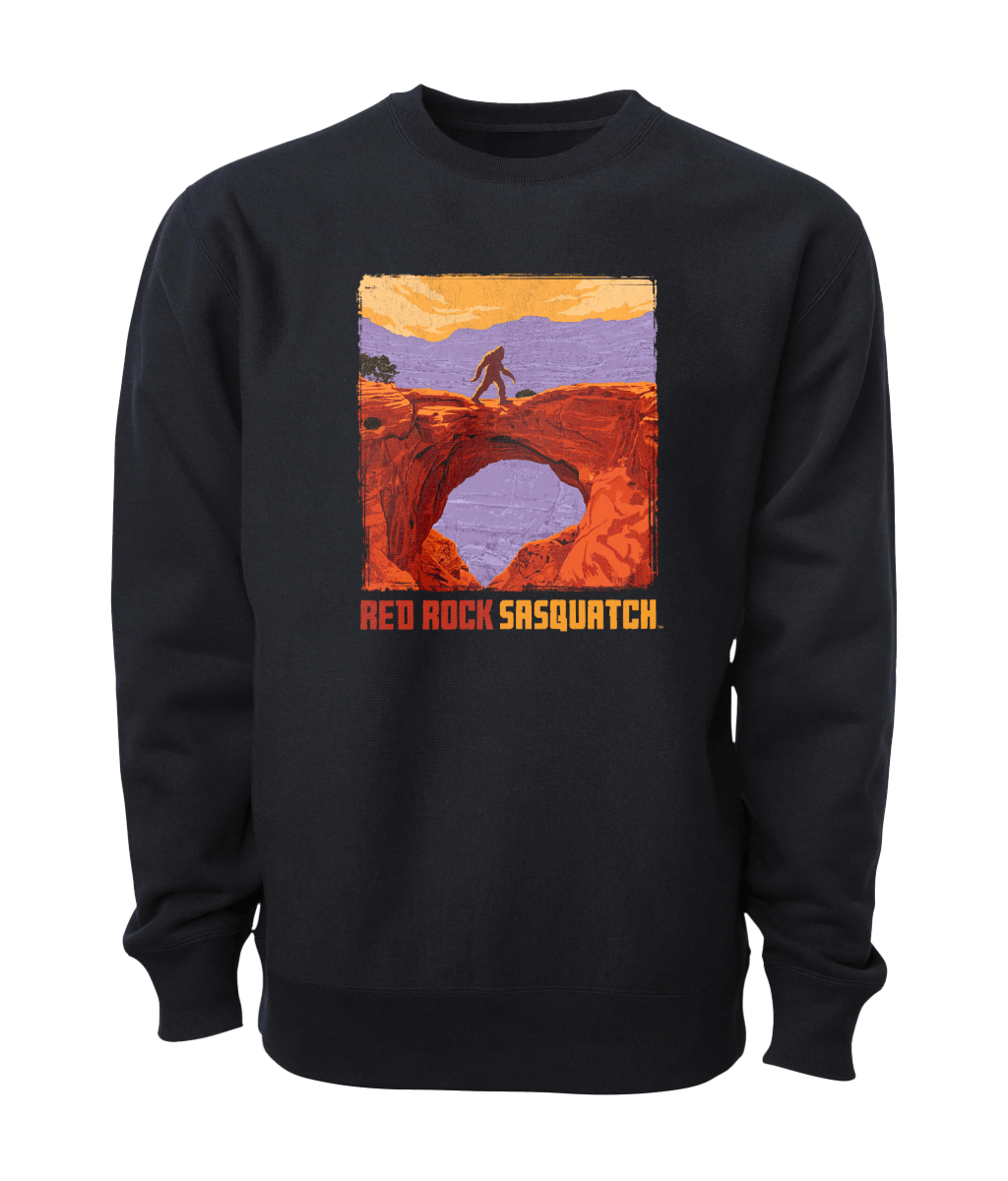 Black Capitol Reef crewneck sweatshirt featuring a graphic of a Sasquatch standing on a natural bridge in Capitol Reef National Park.