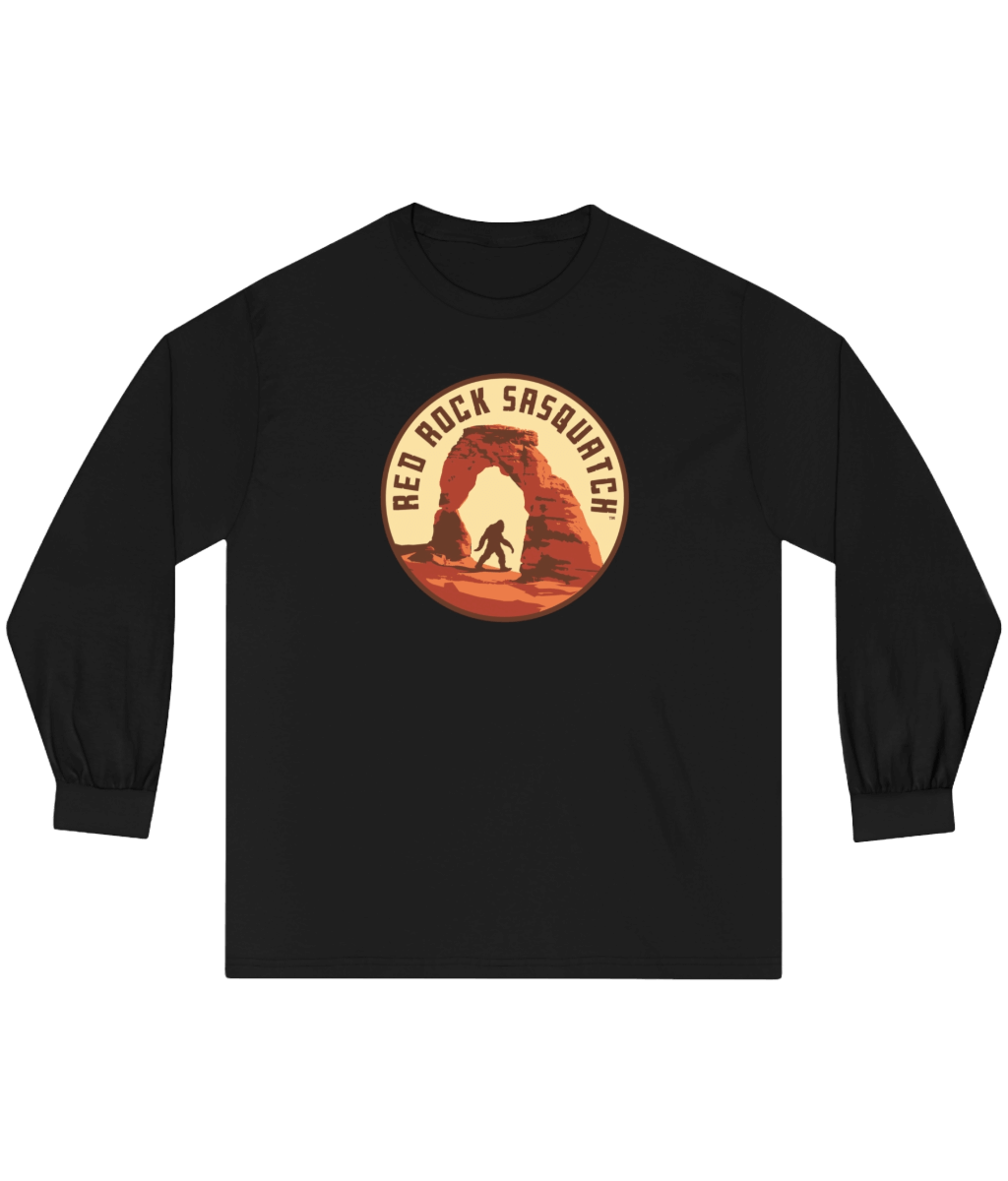 Black long-sleeve Delicate Arch tee. Showcases a unique design of Sasquatch at the iconic Delicate Arch.