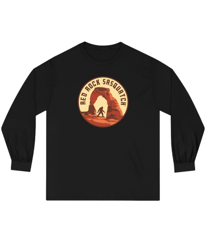 Black long-sleeve Delicate Arch tee. Showcases a unique design of Sasquatch at the iconic Delicate Arch.
