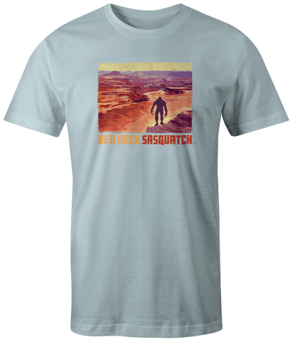 Chambray short-sleeve t-shirt showcasing a Sasquatch figure amidst the dramatic terrain of Canyonlands.