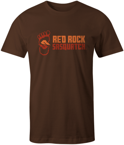 Dark chocolate Standard Logo Tee. Showcases the Red Rock Sasquatch design with the footprint and name aligned horizontally.