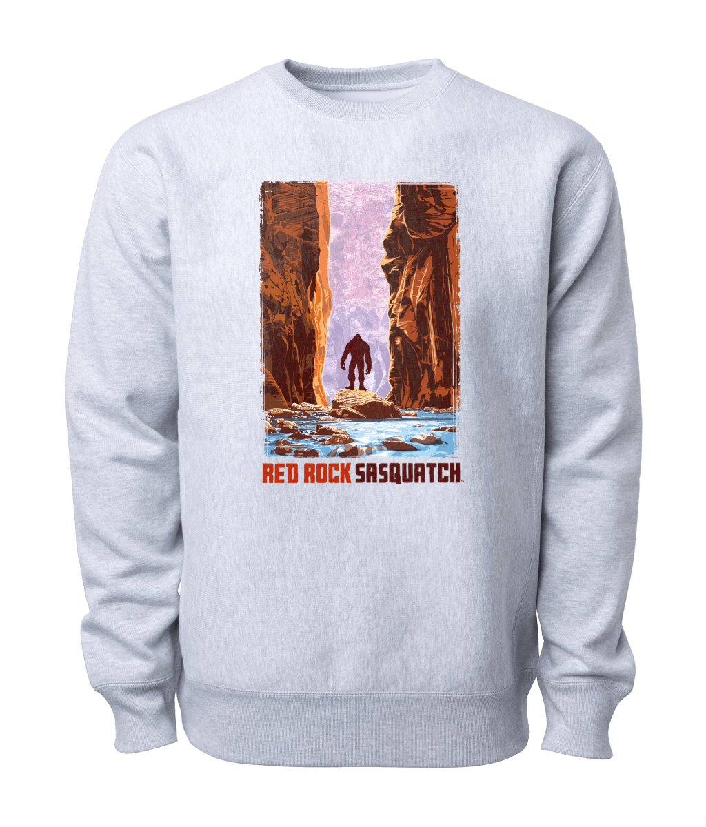 Heather grey Zion crewneck sweatshirt. Features a graphic of a Sasquatch standing in The Narrows, a scenic canyon in Zion National Park.