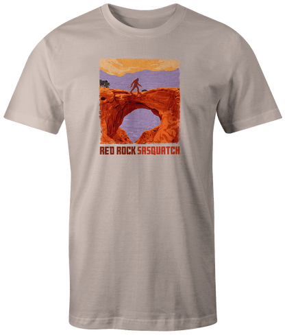 Ivory short-sleeve t-shirt displaying a Sasquatch within the rugged landscape of Capitol Reef National Park.