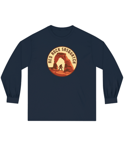 Navy long-sleeve Delicate Arch tee. Features a Sasquatch silhouette within the Delicate Arch formation.