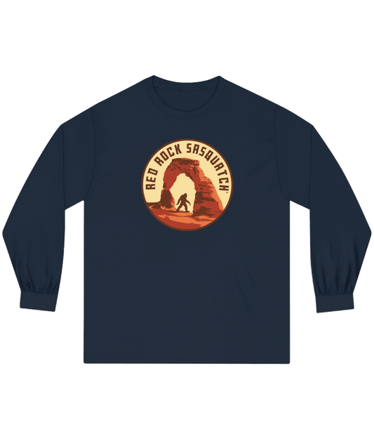 Navy long-sleeve Delicate Arch tee. Features a Sasquatch silhouette within the Delicate Arch formation.