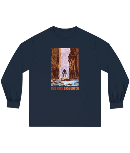 Navy Zion Narrows Long-Sleeve Tee. Depicts Sasquatch in the scenic landscape of The Narrows in Zion.