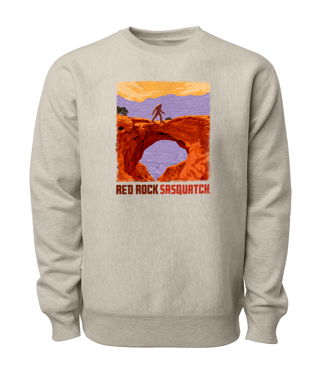 This oatmeal heather-colored Capitol Reef crewneck sweatshirt featuring a Sasquatch crossing Hickman Bridge. Perfect for exploring Utah's national parks.