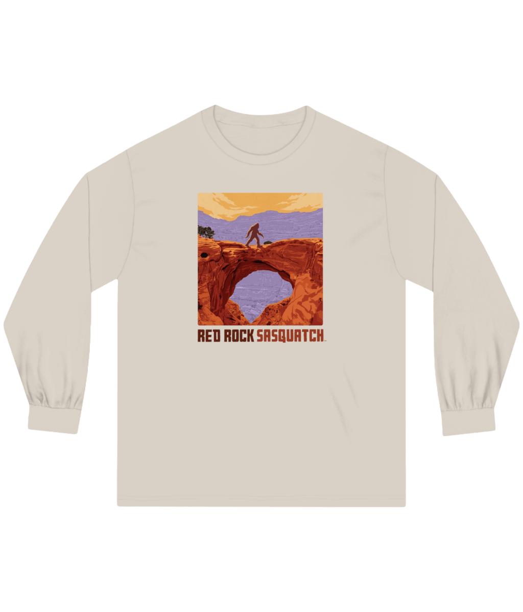 Sand-colored Capitol Reef Long-Sleeve Tee. Features a Sasquatch graphic on a natural bridge formation within Capitol Reef.