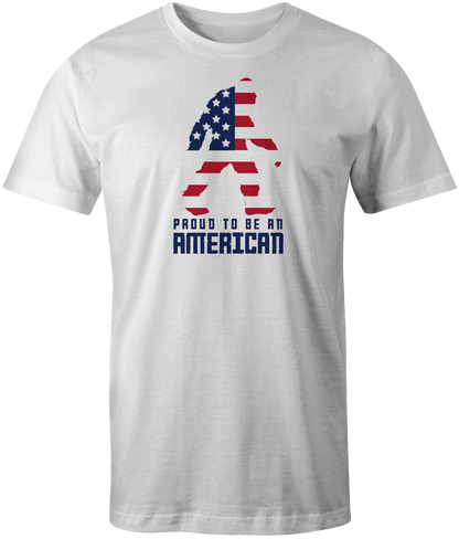 White American Legend Unisex Tee. Bold design with an American flag Sasquatch silhouette and the 'Proud To Be An American' slogan. A statement piece for patriotic individuals.