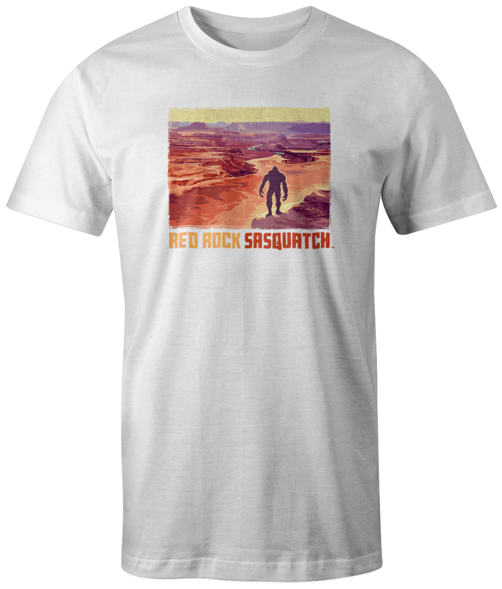 White short-sleeve tee with a unique design of Sasquatch in the expansive landscape of Canyonlands.