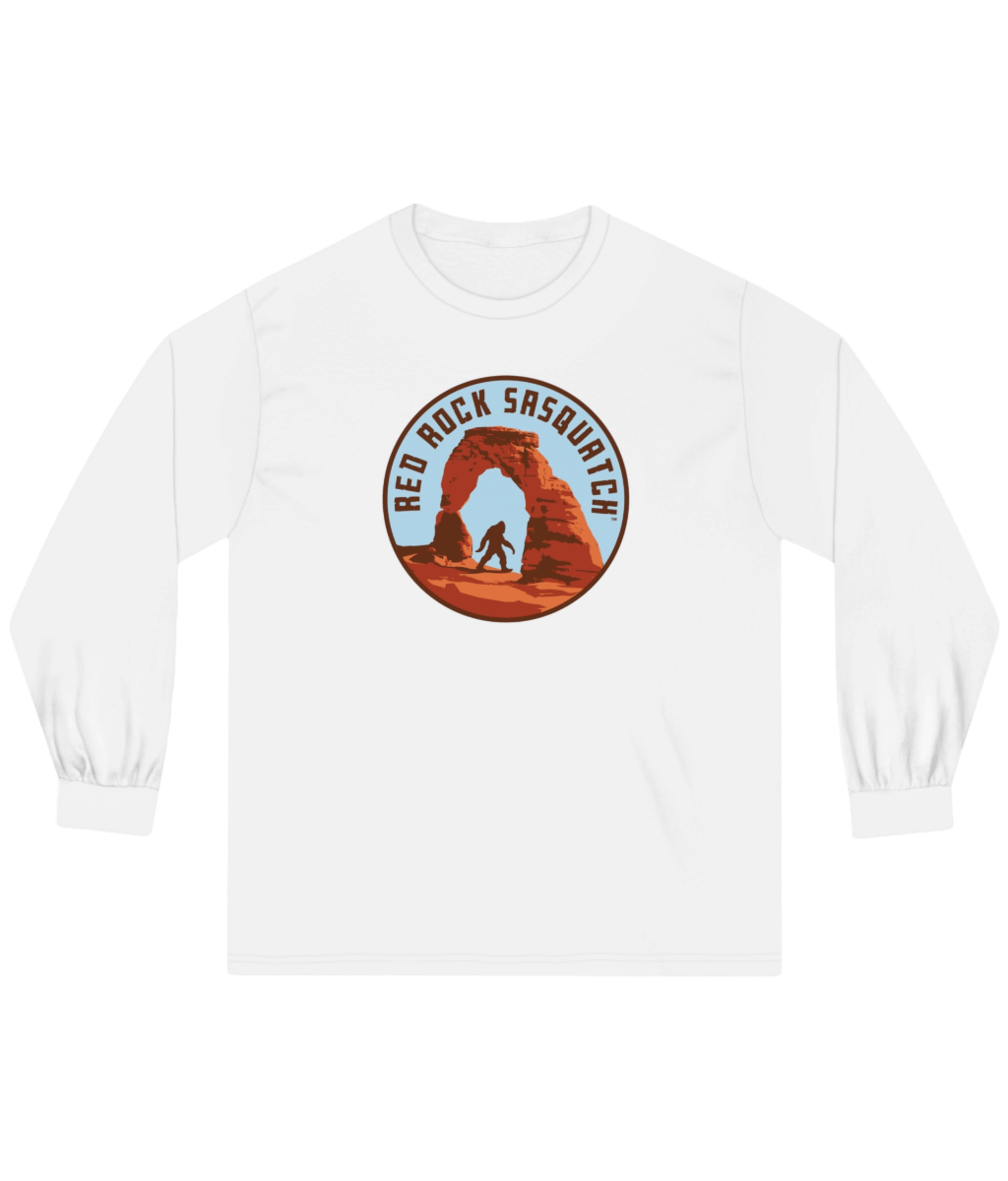White long-sleeve Delicate Arch tee. Features a Sasquatch design at the famous Delicate Arch.