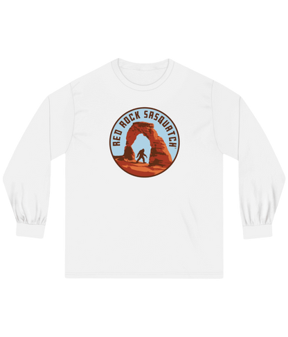 White long-sleeve Delicate Arch tee. Features a Sasquatch design at the famous Delicate Arch.